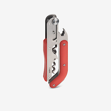 multi-tool with red and silver components in closed position